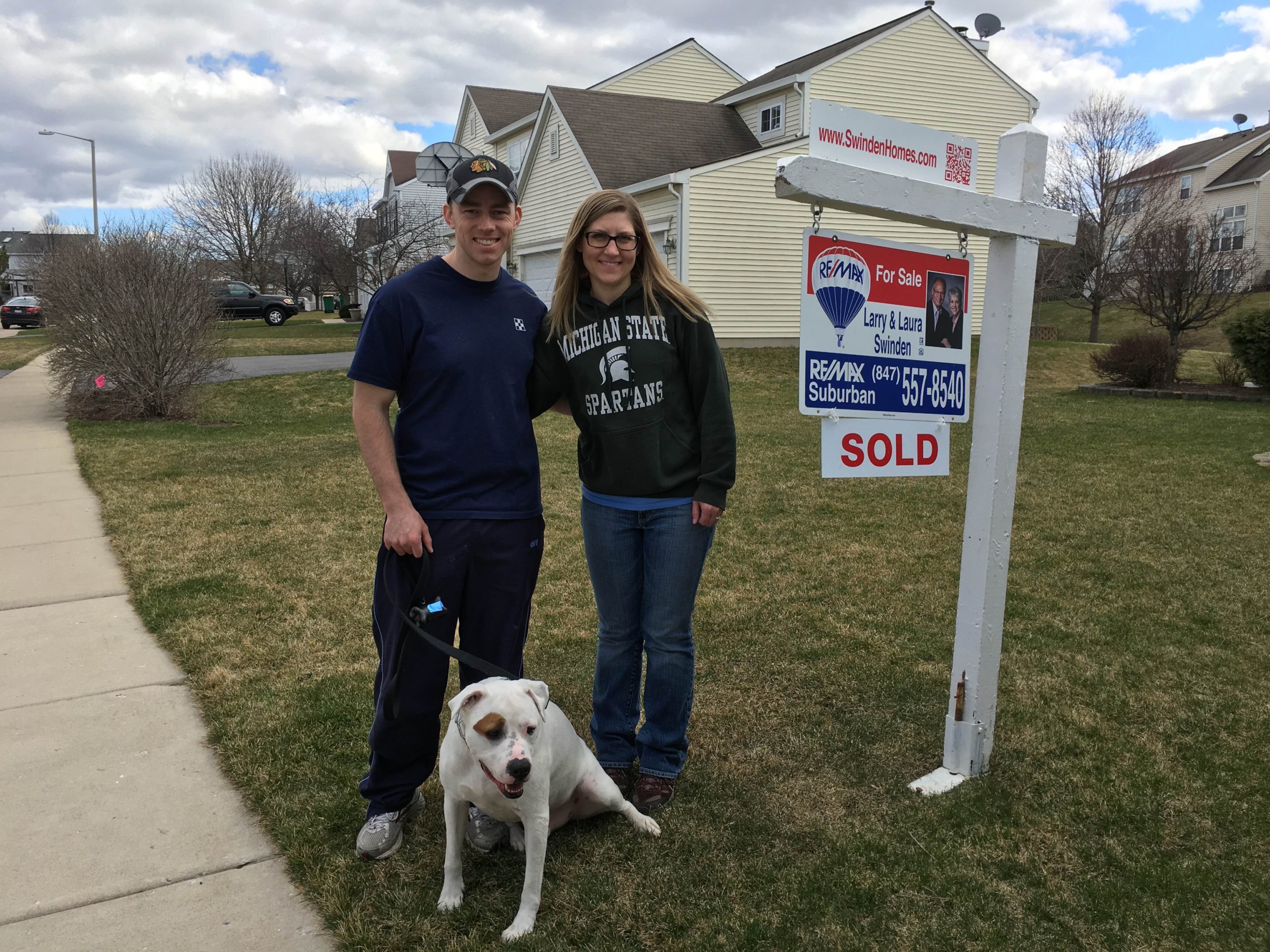 Happy couple with their dog