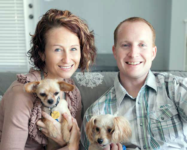 Happy couple with their dogs